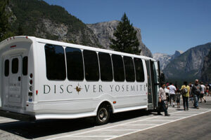 Tour Buses with People looking at Mountains
